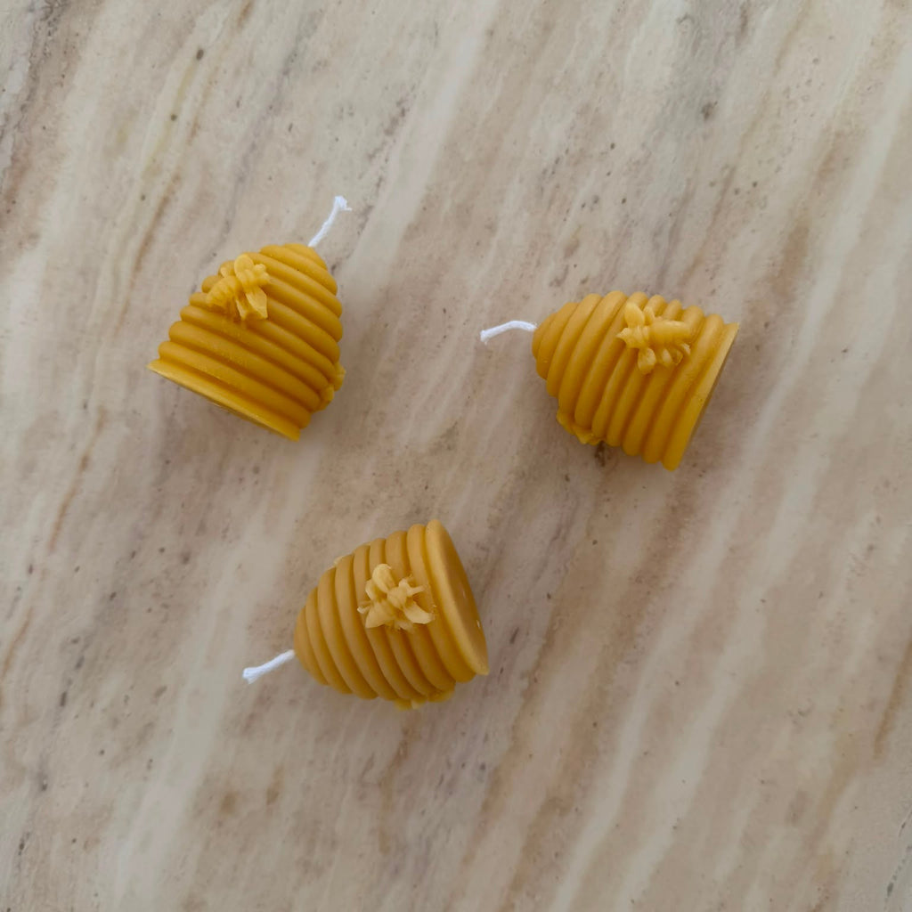 3 Beehive Shapes Beeswax Candles on Marble Surface